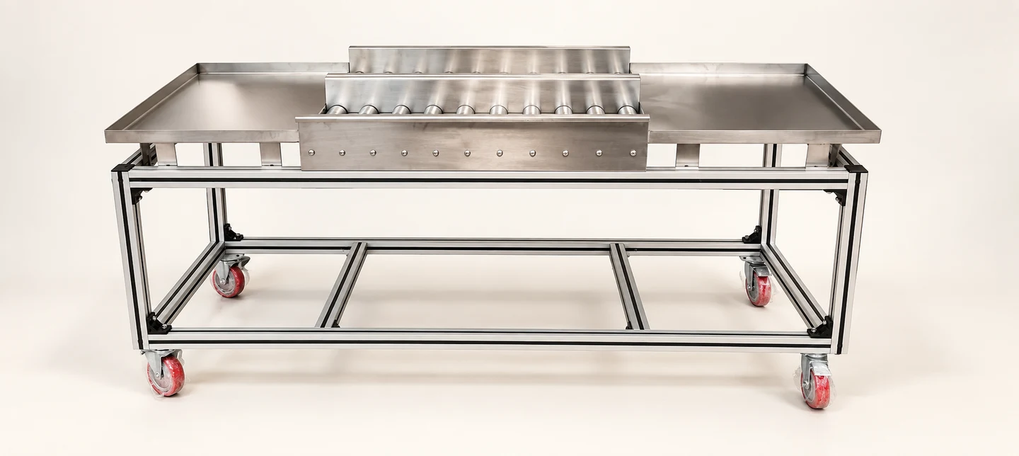 Silver mobile table with central roller sections — AI-cleaned product photograph