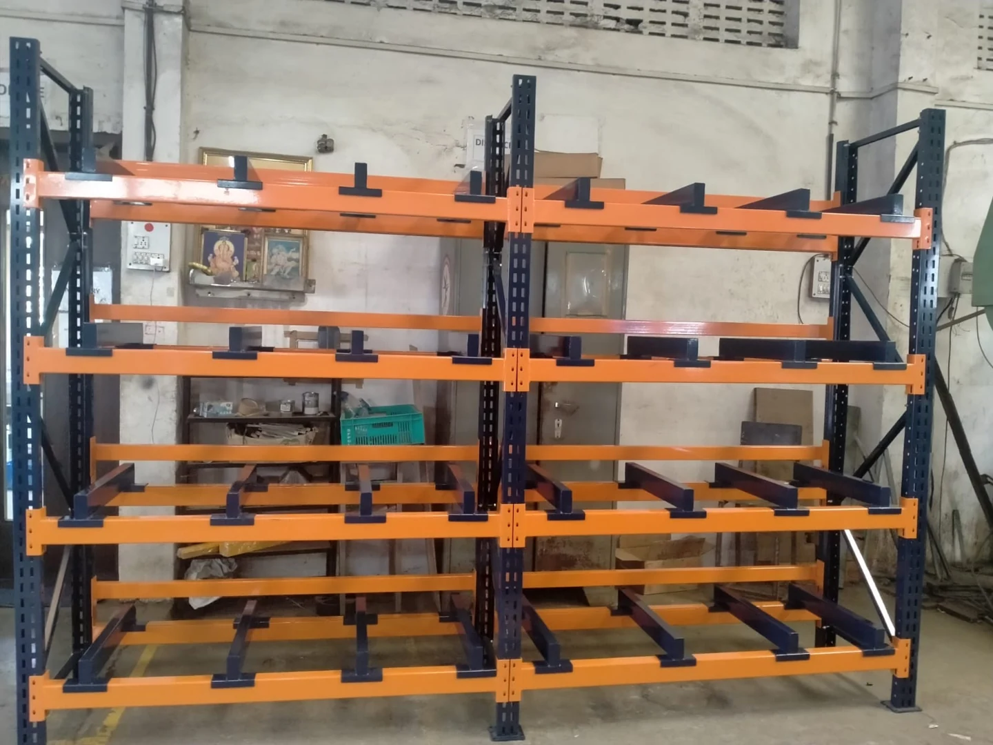 Dark rack with orange support rails — original photograph