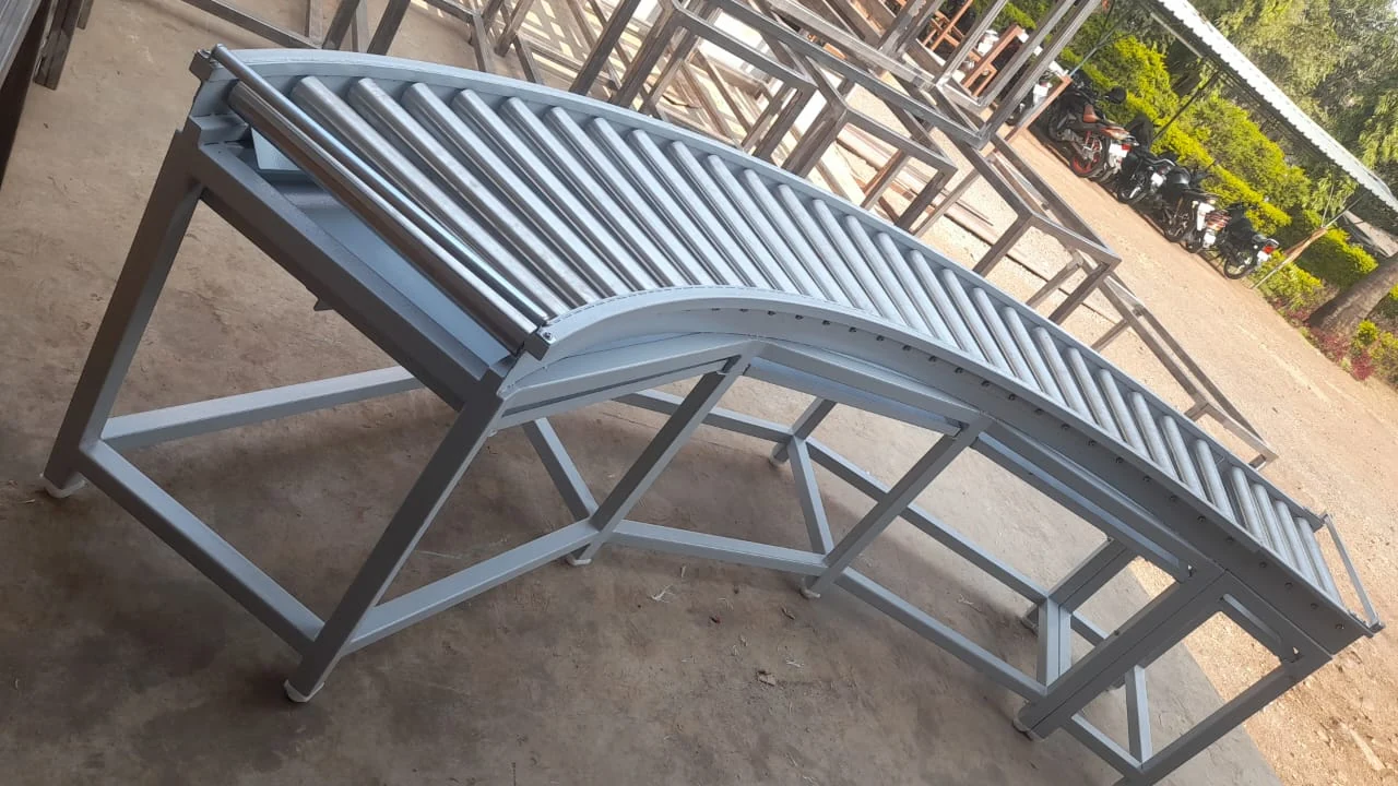 Curved dark roller conveyor — original photograph