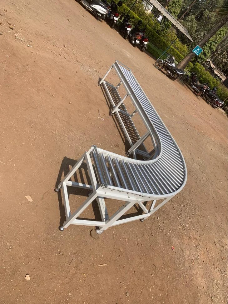 Curved silver roller conveyor — original photograph